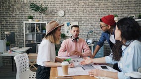 Coworkers having argument discussing business at work looking at building plan stock footage Coworkers having argument discussing business at work looking at building plan stock footage