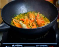 Crabs fried with curry in pan cooking stock photos Crabs fried with curry in pan cooking stock photos