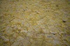 Cracked earth landscape with sulfur like a desert royalty free stock photos Cracked earth landscape with sulfur like a desert royalty free stock photos
