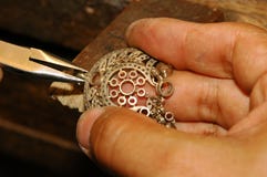 Craftsman making gold jewelry