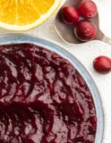 Cranberry sauce and cranberries on a spoon stock images Cranberry sauce and cranberries on a spoon stock images
