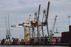 Cranes and ships in the port of Rotterdam at Heijpaat in the waalhaven harbor, The Netherlands. stock image Cranes and ships in the port of Rotterdam at Heijpaat in the waalhaven harbor, The Netherlands. stock image