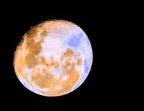 Crater on round moon at night stock photo Crater on round moon at night stock photo