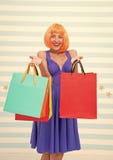 Crazy girl shopping. happy woman with orange hair hold purchase. girl with shop bags after big sale on cyber monday stock images Crazy girl shopping. happy woman with orange hair hold purchase. girl with shop bags after big sale on cyber monday stock images
