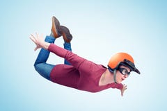 Crazy man in red helmet is flying in the sky. Jumper concept royalty free stock photos Crazy man in red helmet is flying in the sky. Jumper concept royalty free stock photos