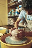 Creating a jar or vase of white clay close-up. Master crock. Stock Photo Creating a jar or vase of white clay close-up. Master crock. Stock Photo