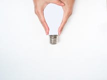 Creation thinking outside box.hand hold light bulb on white background. stock photography Creation thinking outside box.hand hold light bulb on white background. stock photography