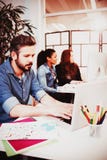 Creative business people using technologies at desk royalty free stock photo Creative business people using technologies at desk royalty free stock photo