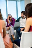 Creative business team consoling upset colleague royalty free stock image Creative business team consoling upset colleague royalty free stock image