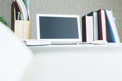 Creative designer desk top with laptop. Close up of creative designer desk top with blank laptop, supplies and other items. Lifestyle and occupation concept Royalty Free Stock Photo Creative designer desk top with laptop. Close up of creative designer desk top with blank laptop, supplies and other items. Lifestyle and occupation concept Royalty Free Stock Photo