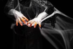 Creepy halloween hand in orange and white with spider web, zombie hand stock photos Creepy halloween hand in orange and white with spider web, zombie hand stock photos