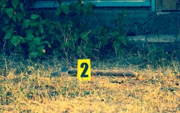 Crime scene, yellow marker evidence, an axe royalty free stock photography Crime scene, yellow marker evidence, an axe royalty free stock photography