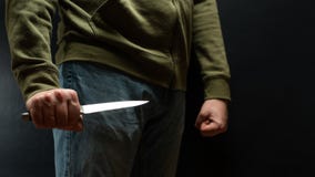 The criminal with a knife weapon threatens to kill. With space for an inscription. News staties, newspaper, social issues, the stock images The criminal with a knife weapon threatens to kill. With space for an inscription. News staties, newspaper, social issues, the stock images
