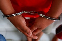 Criminals whose hands are handcuffed, stock photography Criminals whose hands are handcuffed, stock photography