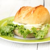 Crisp Bun With Egg And Lettuce Filling Stock Photos