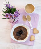 Flowers, cookies and porridge of amaranth with prunes Stock Images Flowers, cookies and porridge of amaranth with prunes Stock Images