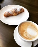 Cool Croissant and coffee on wooden table stock images Cool Croissant and coffee on wooden table stock images
