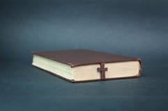 Cross and bible on a blue background. royalty free stock photography Cross and bible on a blue background. royalty free stock photography