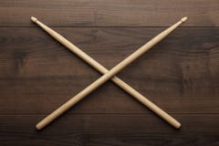 Crossed wooden drumsticks on wooden table royalty free stock images Crossed wooden drumsticks on wooden table royalty free stock images