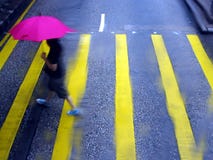 Crossing The Road In The Rain Royalty Free Stock Photography