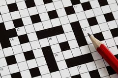 Crossword puzzle. Solving a crossword puzzle with red pencil Crossword puzzle. Solving a crossword puzzle with red pencil