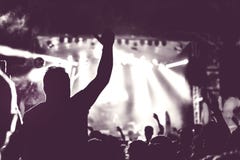 Crowd of audience with hands raised at a music festival Stock Photo Crowd of audience with hands raised at a music festival Stock Photo