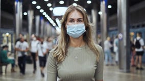 Woman in mask walk crowded station metro coronavirus. Girl going subway covid-19