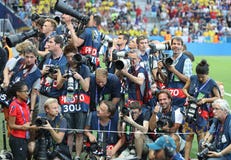 Crowd of sports photographers before the football match