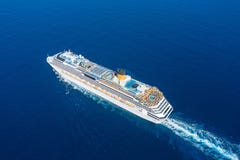 Cruise Ship Liner Sails In The Blue Sea Leaving A Plume On The Surface Of The Water Seascape. Aerial View The Concept Of Sea Royalty Free Stock Images