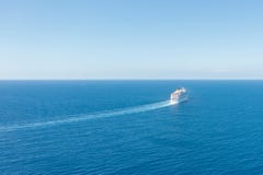 Cruise Ship Liner Sails In The Blue Sea Leaving A Plume On The Surface Of The Water Seascape. Aerial View The Concept Of Sea Stock Photos