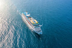 Cruise Ship Liner Sails In The Sea Leaving A Plume On The Surface Of The Water Seascape. Aerial View The Concept Of Sea Travel, Stock Image