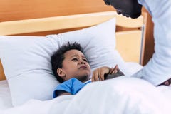 Crying african american boy in hospital Royalty Free Stock Photography Crying african american boy in hospital Royalty Free Stock Photography