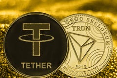 Cryptocurrency USDT και TRX νομισμάτων στο χρυσό υπόβαθρο στοκ φωτογραφίες με δικαίωμα ελεύθερης χρήσης Cryptocurrency USDT και TRX νομισμάτων στο χρυσό υπόβαθρο στοκ φωτογραφίες με δικαίωμα ελεύθερης χρήσης