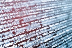 CSS som programmerar kod på skärmen i blått, tonar och rött ljusläcka Royaltyfria Bilder CSS som programmerar kod på skärmen i blått, tonar och rött ljusläcka Royaltyfria Bilder