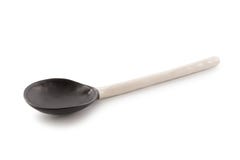 Cucchiaio ceramico in bianco e nero isolato su un fondo bianco fotografie stock libere da diritti Cucchiaio ceramico in bianco e nero isolato su un fondo bianco fotografie stock libere da diritti