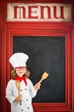 Cuisinier de chef d'enfant Concept de restauration images stock Cuisinier de chef d'enfant Concept de restauration images stock