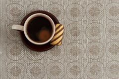 Cup of coffee and cookie on plate against monochromic tablecloth with copy space Royalty Free Stock Photo Cup of coffee and cookie on plate against monochromic tablecloth with copy space Royalty Free Stock Photo