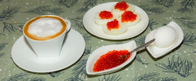 Cup of coffee. Egg with red caviar royalty free stock image Cup of coffee. Egg with red caviar royalty free stock image