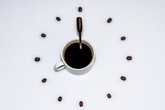 Cup of coffee surrounded by beans Cup of coffee surrounded by beans