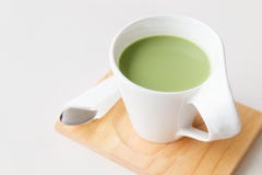 Cup of hot milk green tea on white table Royalty Free Stock Photos Cup of hot milk green tea on white table Royalty Free Stock Photos