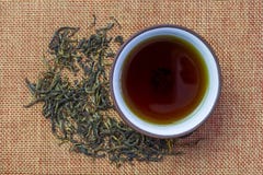 Cup with tea and teapot, loose tea stock photography Cup with tea and teapot, loose tea stock photography