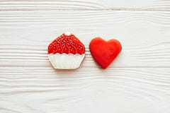 Cupcake and heart icing cookies on white wood, flat lay with space for text. Delicious sweets. Happy Mothers day. Valentine day stock photography Cupcake and heart icing cookies on white wood, flat lay with space for text. Delicious sweets. Happy Mothers day. Valentine day stock photography