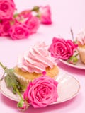 Cupcake With Pink Cream Decoration And Roses On Pink Pastel Background. Royalty Free Stock Photo