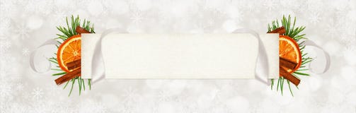 Curled gray silk ribbon and a paper card for text with Christmas stock image Curled gray silk ribbon and a paper card for text with Christmas stock image