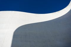 The Curved detail and shadow of concrete with beautiful blue sky