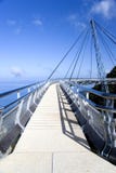 Curved Suspension Bridge. For pedestrians on Gunung (Mount) Mat Cincang, Langkawi Island, Malaysia. This suspension bridge was the winner of a prestigious Swiss Royalty Free Stock Photos Curved Suspension Bridge. For pedestrians on Gunung (Mount) Mat Cincang, Langkawi Island, Malaysia. This suspension bridge was the winner of a prestigious Swiss Royalty Free Stock Photos