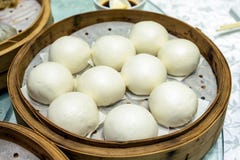 Custard lava cream and roasted red pork filled bun on bamboo tray royalty free stock photos Custard lava cream and roasted red pork filled bun on bamboo tray royalty free stock photos