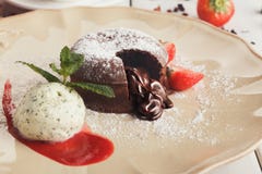 Chocolate fondant with vanilla ice cream and strawberry Royalty Free Stock Image Chocolate fondant with vanilla ice cream and strawberry Royalty Free Stock Image