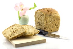 Cut Rye Bread Loaf And A Flower In A Vase, Isolate Royalty Free Stock Photo Cut Rye Bread Loaf And A Flower In A Vase, Isolate Royalty Free Stock Photo