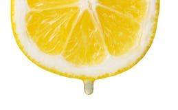 Cut Slice Of Lemon With Drop Of Juice Isolated On White Royalty Free Stock Photo